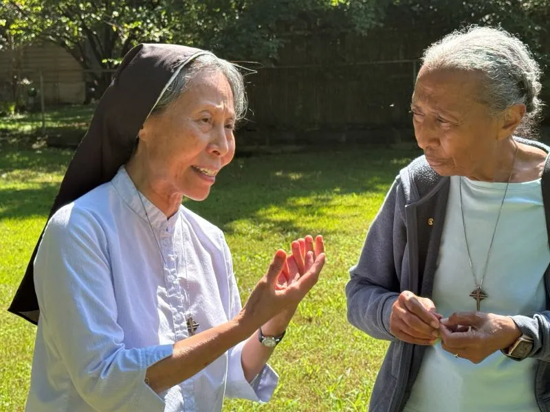Srs. Christine and Barbara in conversation outside.
