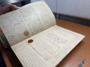 This is a photo of a book from our archives that our archivist needed to rebound.