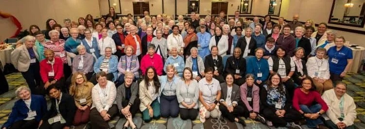 Sisters and partners-in-mission in a group photo during the 2025 Regional Chapter event.