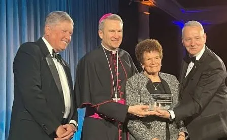 Sr. Paulette LoMonacco receiving her award. 