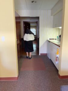 Sister Elise Kramer walking down hallway