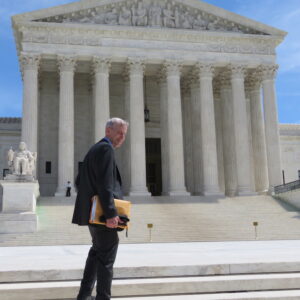 Larry Couch walking up steps to Capitol Hill
