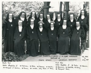 Group of 14 Contemplative Sisters wearing their brown habits in 1964